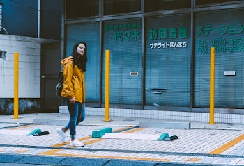Photo of Woman Wearing Yellow Jacket