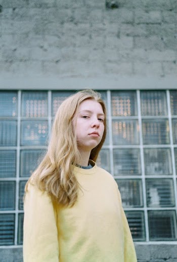 Photo Of Woman Wearing Yellow Sweater · Free Stock Photo