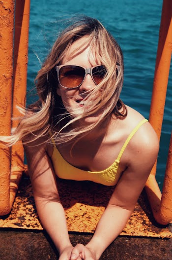 Photo of Woman Wearing Yellow Tank Top