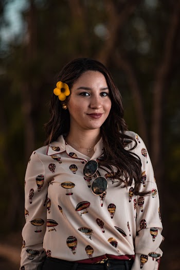 Photo of Woman With Flowers On Her Ear