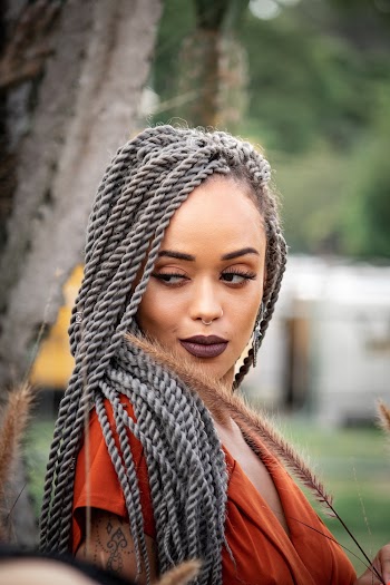 Photo of Woman With Grey Braids Posing
