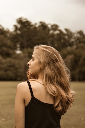 Photo of Woman With Her Back Showing Posing