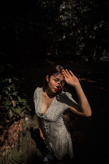 Photo Of Woman With Her Hands Covering Sunlight 