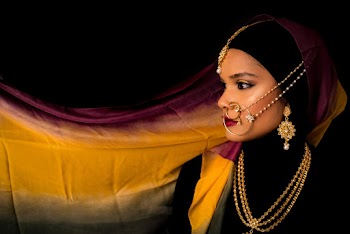 Photo of Woman With Large Nose Ring Posing While Looking Away