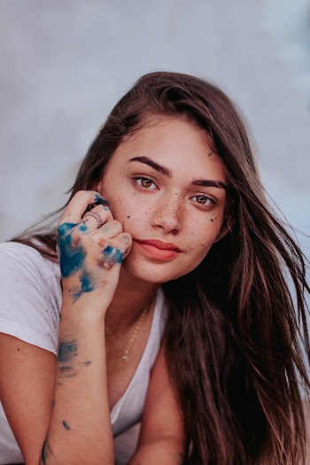 Photo of Woman With Paint on Her Hand