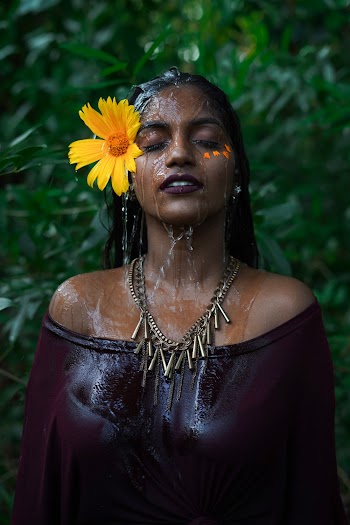 Photo Of Woman With Sunflower On Her Ear