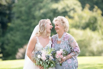 Photo of Women Holding Bouquet