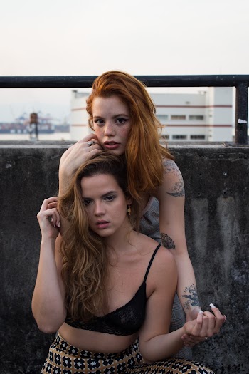 Photo Of Women Holding Each Other