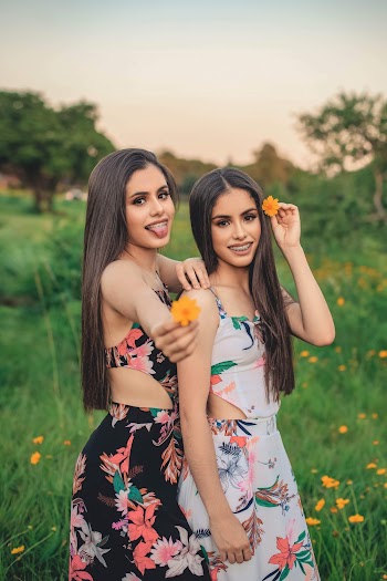 Photo Of Women Holding Flowers