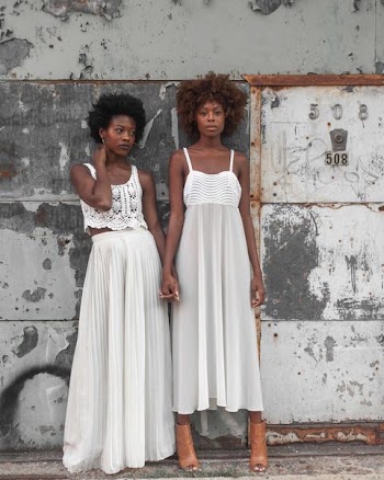 Photo of Women in White Sleeveless Dresses