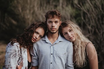 Photo of Women Leaning On A Guy