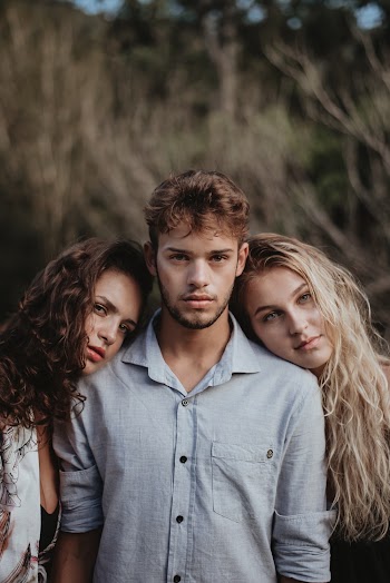 Photo of Women Leaning On A Man