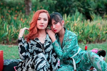 Photo Of Women Leaning On Each Other
