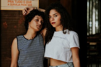 Photo Of Women Leaning On The Wall