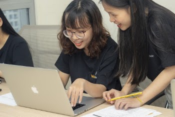 Photo Of Women Looking In The Laptop