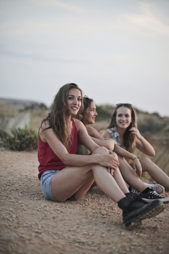 Photo Of Women Sitting On Ground