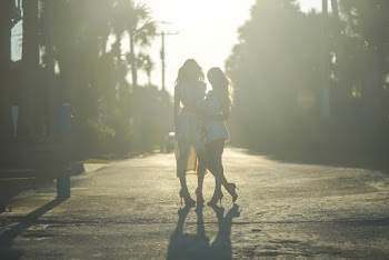 Photo of Women Standing on Street