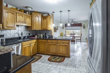 Photo of Wooden Cabinets and Refrigerator