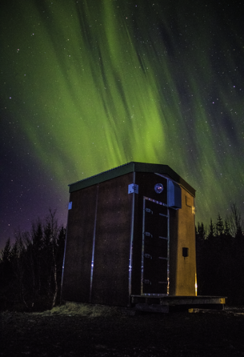 Photo of Wooden Shed Under Northern Lights