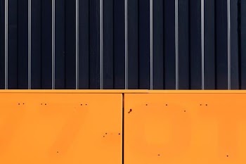 photo of yellow door with grill