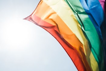 photo of yellow, orange, and blue blanket