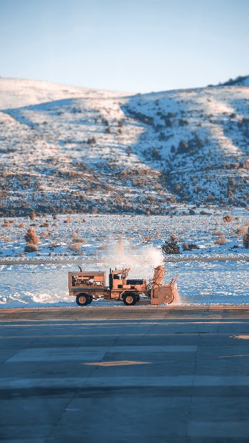 Photo Of Yellow Truck Beside Road