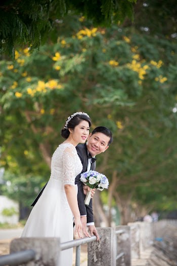 Photo Shoot Of A Wedding Coupe Beside Gray Balcony