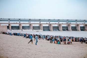Photograph of a Crowd by the Water