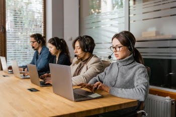 Photograph of Agents Working on Their Laptops · Free Stock Photo