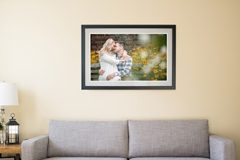 Photograph of Couple on White Wall