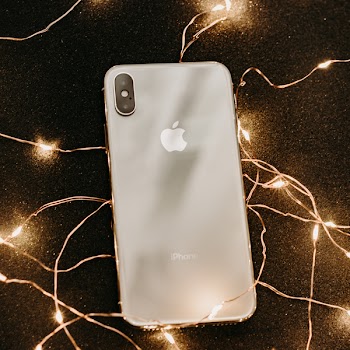 Photograph of iPhone Surrounded with Fairy Lights
