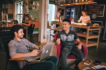 Photograph of Men Having Conversation Seating on Chair · Free Stock Photo
