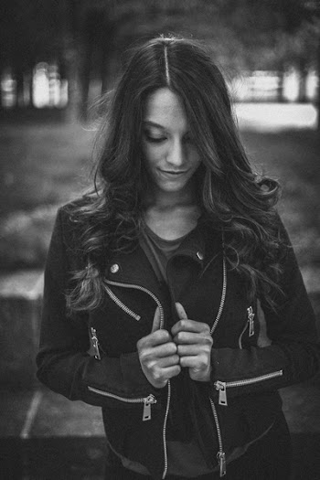 Photograph of Woman with Head Down