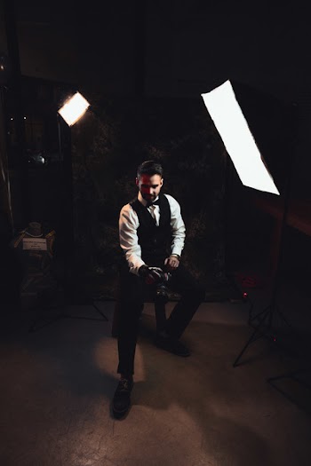 Photographer beside Soft box