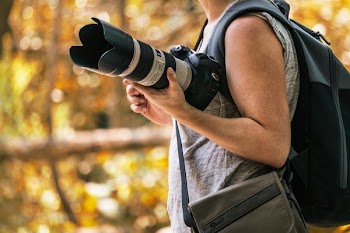 Photographer Holding Camera