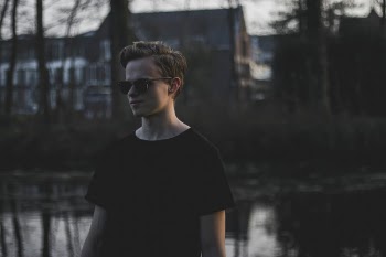 Photography of a Boy Wearing Sunglasses