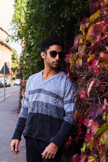 Photography of a Guy Near Leaves