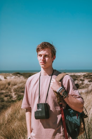 Photography of a Man Carrying Bag