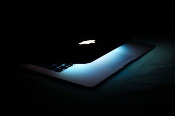 Photography of a Turned On Macbook