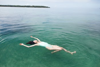Photography of a Woman Floating on Water