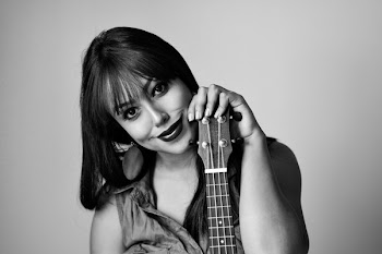 Photography of a Woman Holding Ukelele