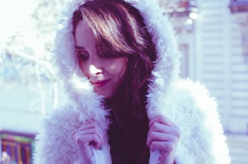 Photography of a Woman in White Fur Coat