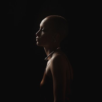 Photography of a Woman On Dark Area