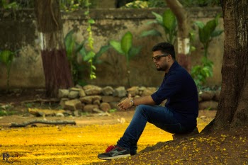 Photography of a Woman Sitting Near Tree