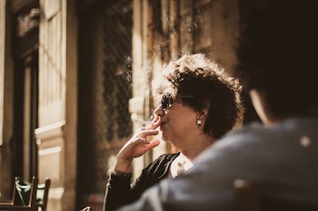 Photography of a Woman Smoking Cigarette