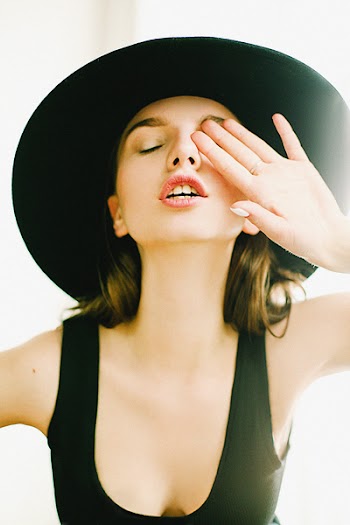 Photography of a Woman Wearing Black Scoop Neck Top