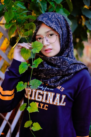 Photography of a Woman Wearing Blue Hijab