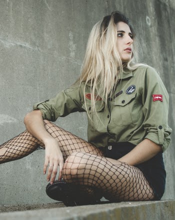 Photography of a Woman Wearing Fishnet Leggings