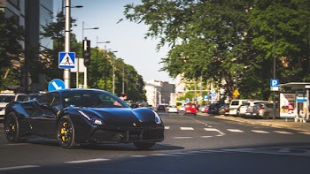 Photography of Black Ferrari on Roadway