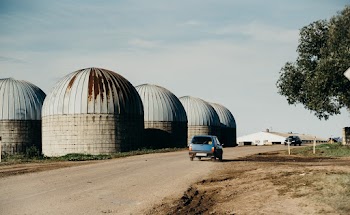 Photography of Blue Vehicle Traveling on Road